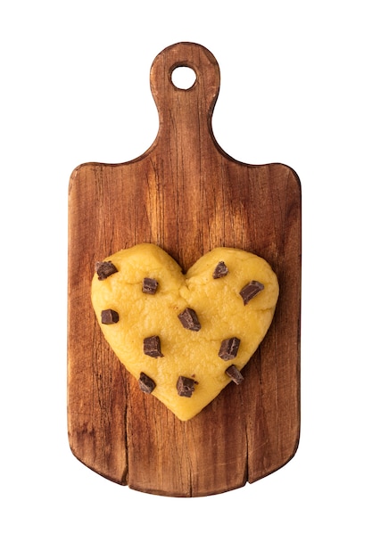 Raw cookie dough with chocolate chips in the shape of a heart