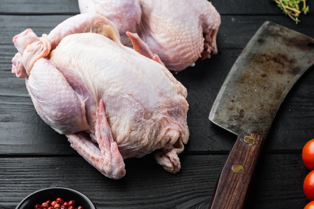 Raw coquelet chickens with herbs spices ingredients