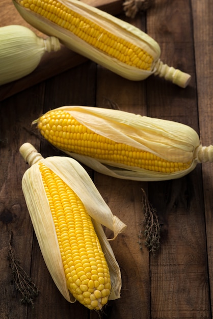 raw corn on wood