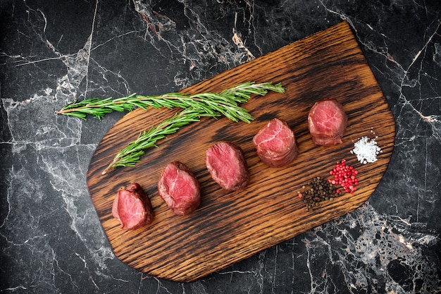 Raw deer tenderloin on the Board