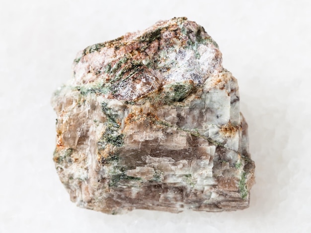 Raw Delhayelite stone on white