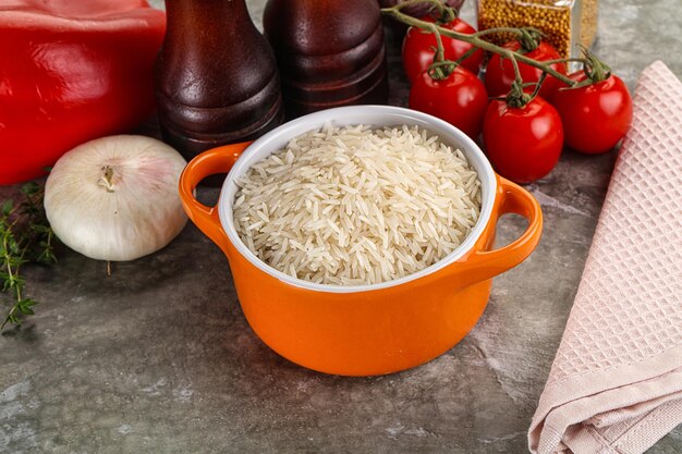 Raw delicous basmati rice heap in the bowl