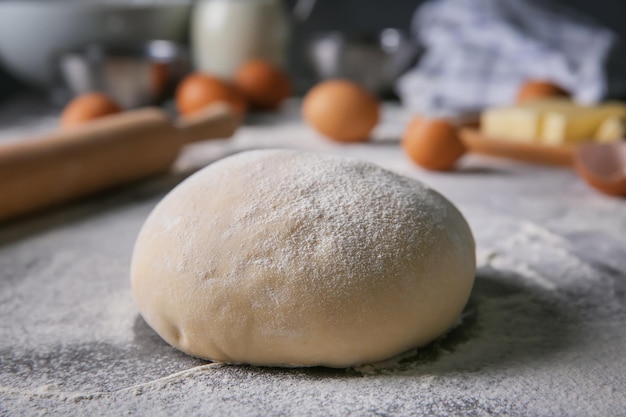 Raw dough on kitchen table