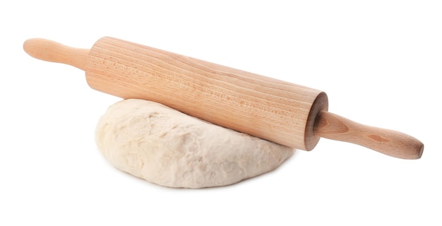 Raw dough with rolling pin on white background