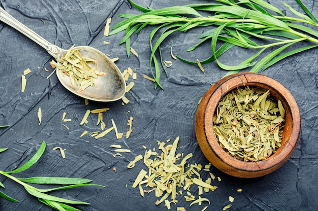 Raw and dry tarragon spice.Tarragon or Artemisia dracunculus