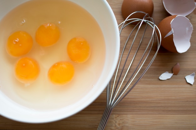 Raw Egg Yolk in white bolw  for cook