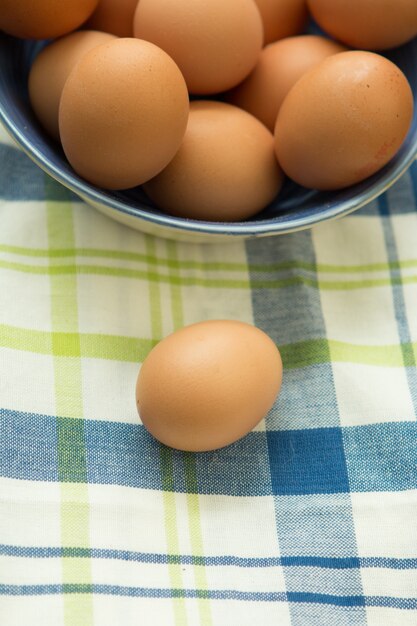 Raw eggs on a blue napkin