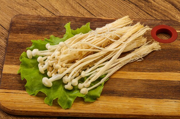 Raw Enoki mushrooms for cooking