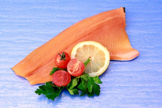 raw fillet of salmon with lemon slices