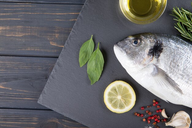 Raw fish dorado cooking and ingredients.