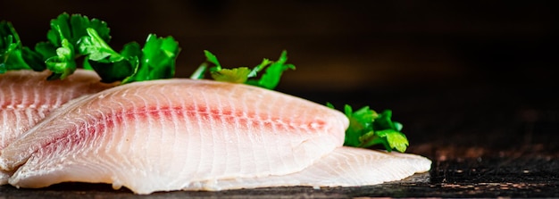 Raw fish fillet with parsley