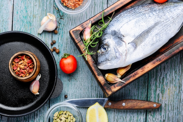 Raw fish and ingredients for cooking