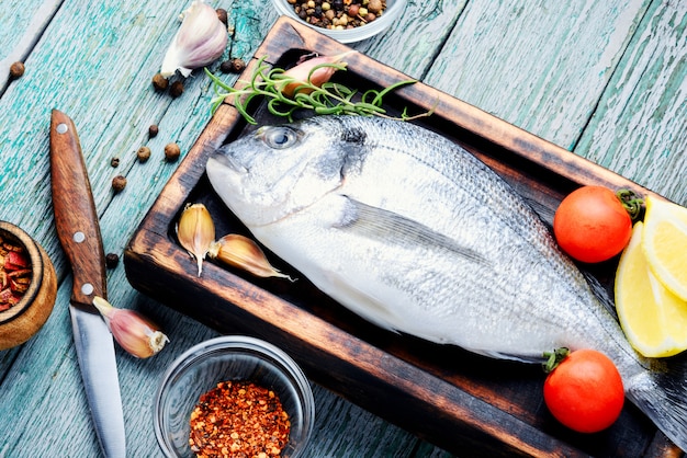 Raw fish and ingredients for cooking