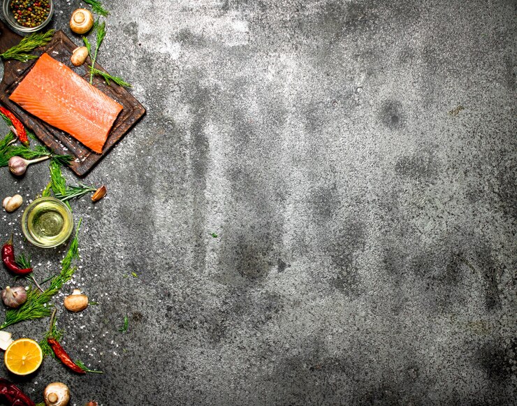 Photo raw fish. salmon fillet with herbs and spices on rustic table.