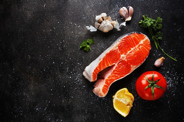 Raw fish steaks with ingredients