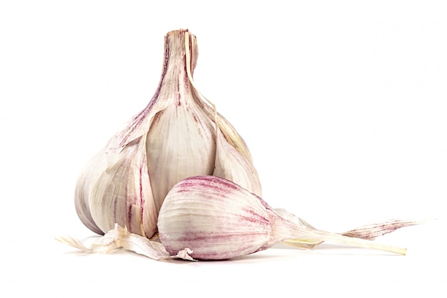 Raw fresh garlic isolated on white