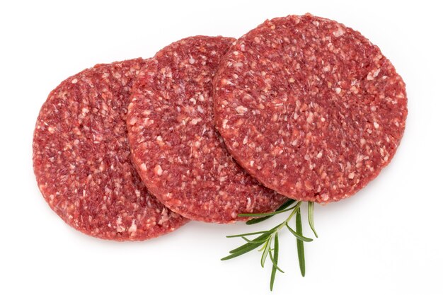 Raw fresh hamburger meat against white surface