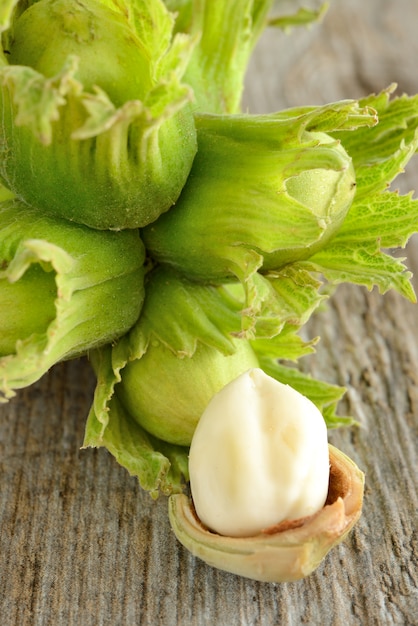 raw fresh hazelnuts on wooden table