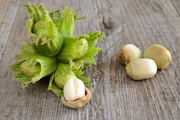 raw fresh hazelnuts on wooden table