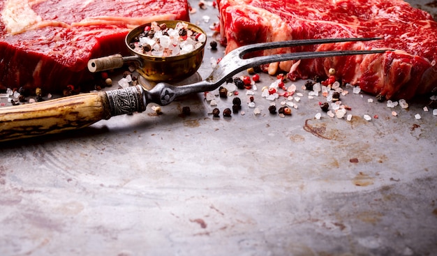 Raw Fresh Marbled Meat Beef Steak and Meat Fork Seasonings 