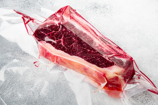 Raw fresh meat Club Steak in vacuum marketpack