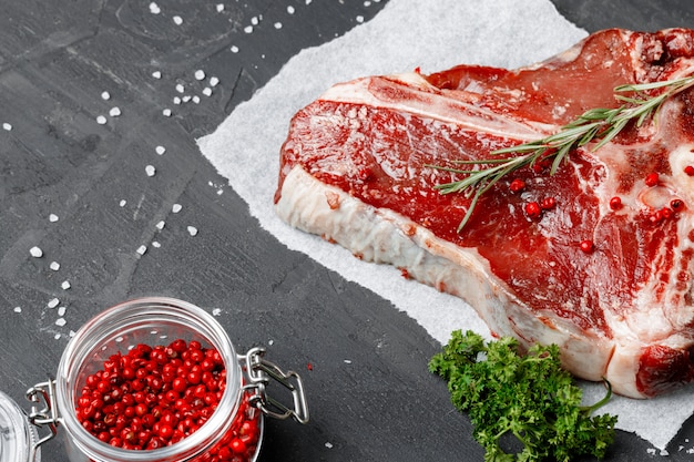 Raw fresh meat t-bone steak with spices