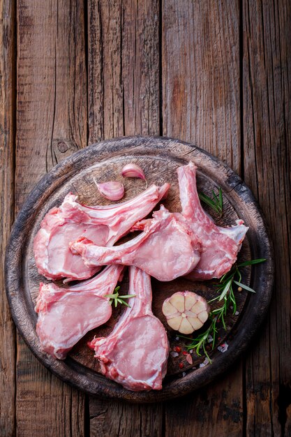 Raw fresh meat Veal rib Steak on bone and meat fork  