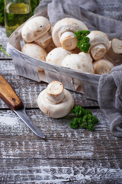 Raw fresh mushroom in basket. Selective focus