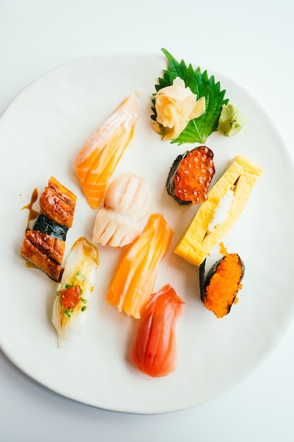 Raw and fresh nigiri sushi set in white plate