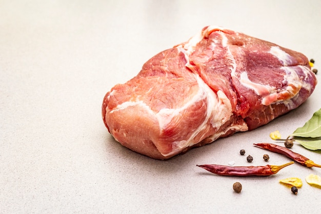 Raw fresh pork shoulder with spices