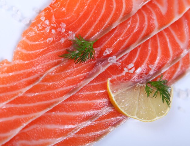 Raw fresh red salmon at white plate