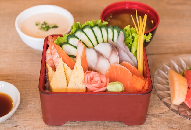 Raw fresh sashimi with rice in bento box