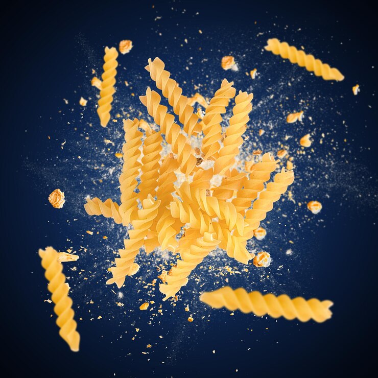 Raw fusilli pasta is flying