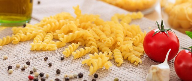 Raw fusilli pasta with vegetables