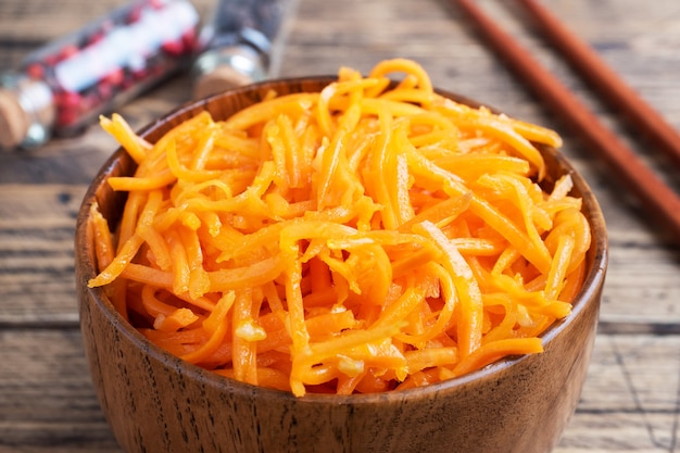 Raw grated spicy carrot salad in a bowl