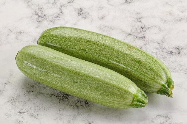 Photo raw green ripe zucchini vegetable