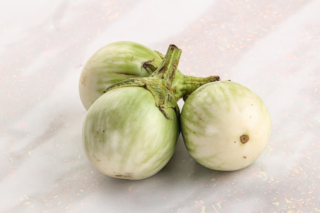 Raw green round eggplant vegetable heap