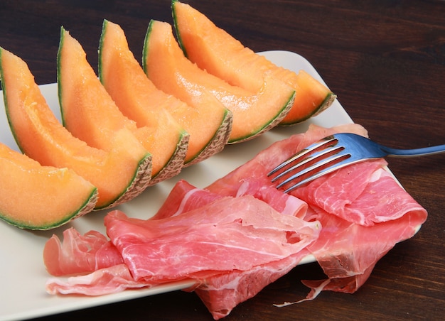 raw ham and melon slices