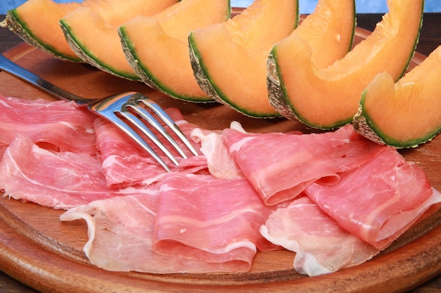 raw ham and melon slices