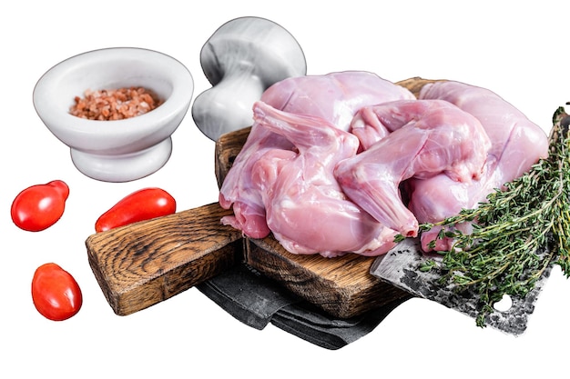 Raw hare legs on a butcher board with thyme Isolated on white background top view