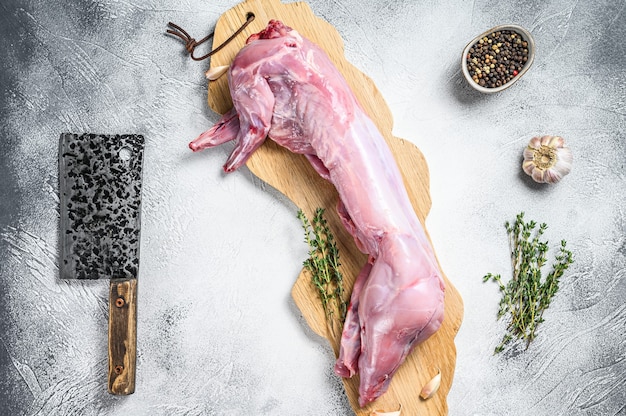 Photo raw hare meat on a cutting board