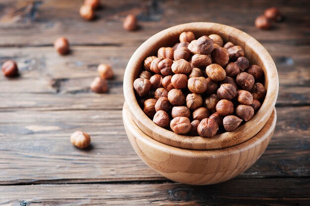 Raw healthy hazelnut on the wooden table