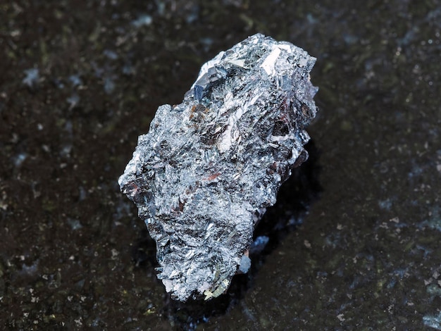 Raw hematite ore on dark background