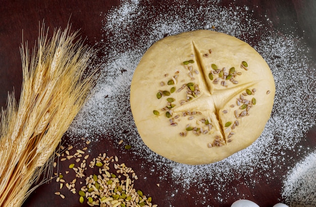 Raw homemade bread with pumpkin and sunflower seeds