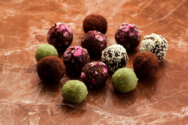 Raw homemade candy truffles on a marble background Organic Healthy Product Gluten free
