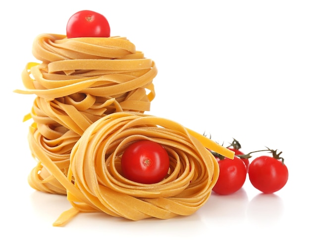 Raw homemade pasta and tomatoes isolated on white