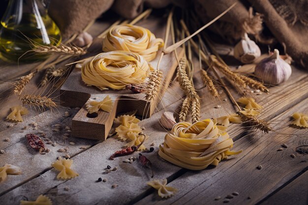 Raw homemade pasta with flour and spices 