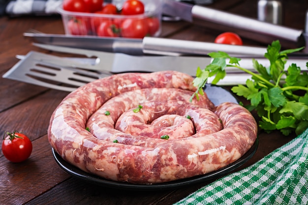 Raw homemade sausage with spices