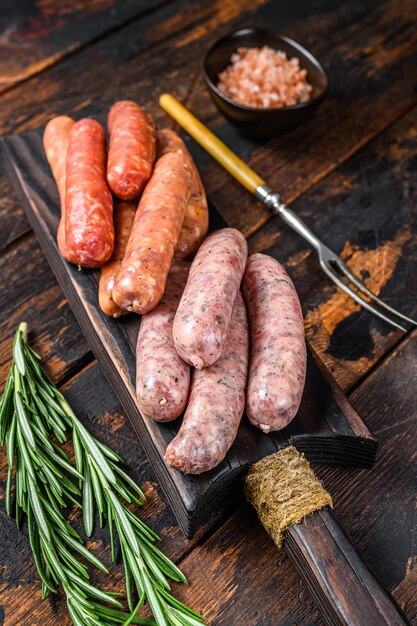 Raw homemade sausages on a cutting board