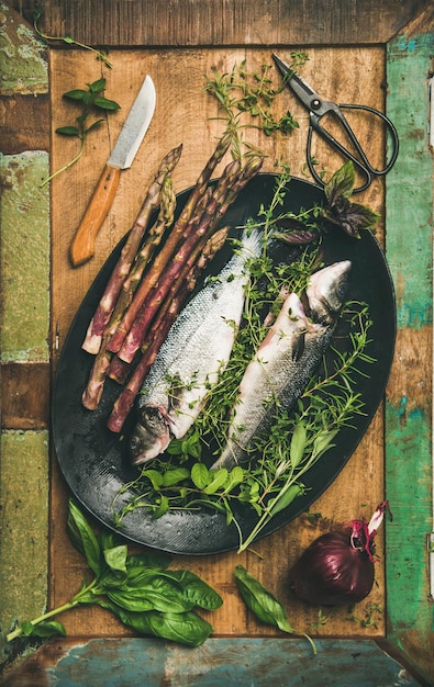 Raw incooked sea bass with herbs